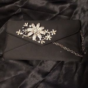 Fashion handbag. New! Blk with white rhinestone flower.  It has a chain.